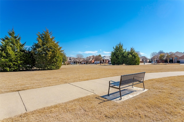 view of home's community with a yard and a residential view