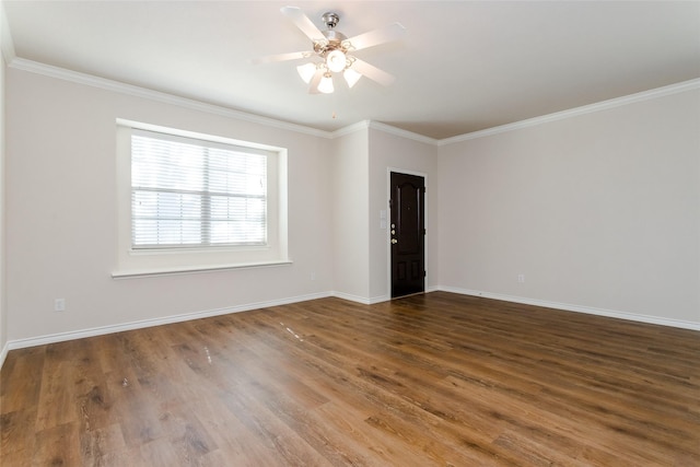 unfurnished room featuring baseboards, wood finished floors, a ceiling fan, and crown molding