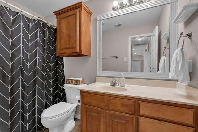 full bath featuring visible vents, vanity, and toilet