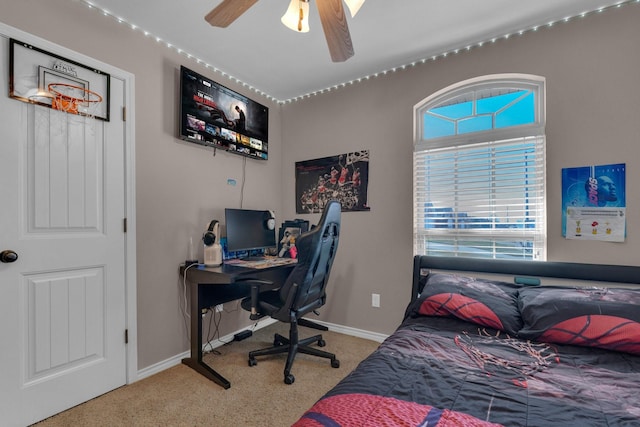 bedroom featuring ceiling fan and baseboards