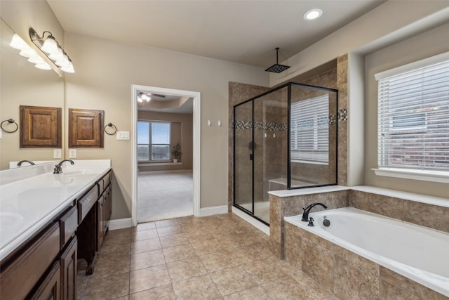 bathroom with tile patterned flooring, a sink, a shower stall, a bath, and double vanity