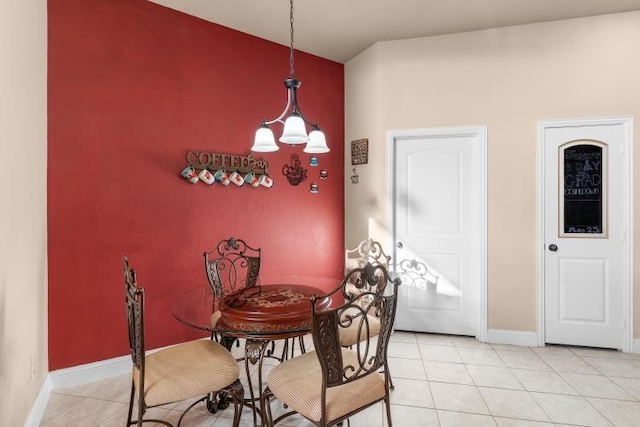 dining area with light tile patterned floors and baseboards