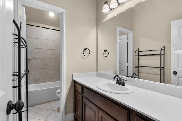 bathroom with tile patterned flooring, vanity, toilet, and bathing tub / shower combination