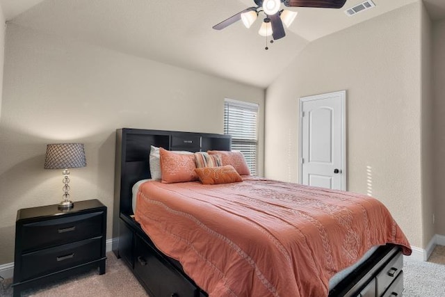 bedroom with light colored carpet, visible vents, vaulted ceiling, ceiling fan, and baseboards