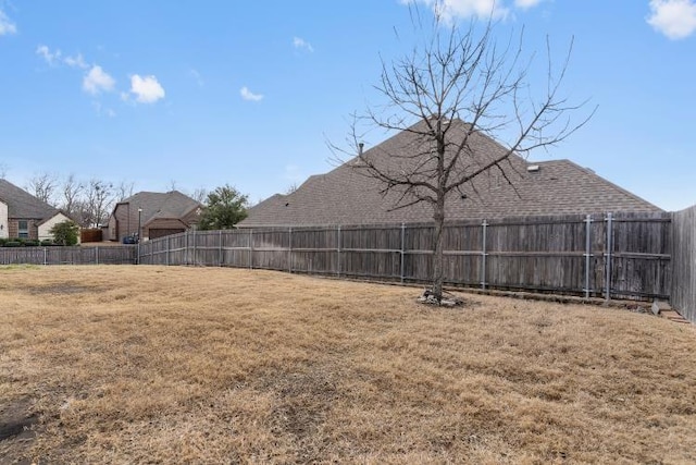 view of yard with a fenced backyard