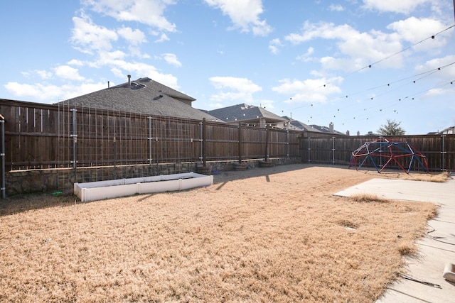 view of yard with a fenced backyard