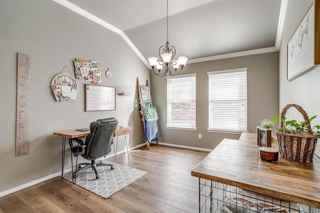 office space with a chandelier, lofted ceiling, crown molding, and wood finished floors