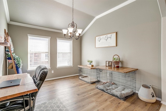 office area with a chandelier, wood finished floors, baseboards, vaulted ceiling, and ornamental molding