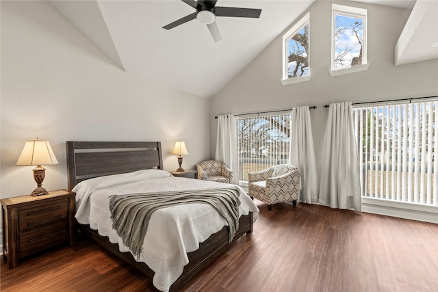 bedroom featuring dark wood-style floors, ceiling fan, and high vaulted ceiling