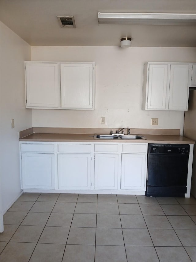 kitchen featuring light tile patterned floors, visible vents, white cabinetry, a sink, and dishwasher