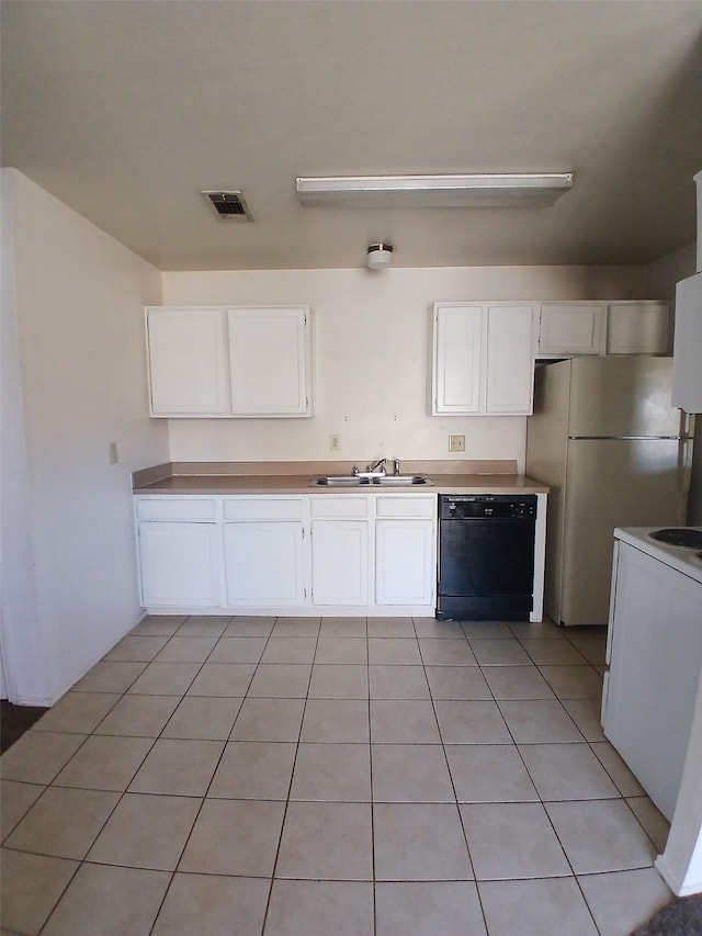 kitchen with light countertops, white appliances, white cabinets, and visible vents