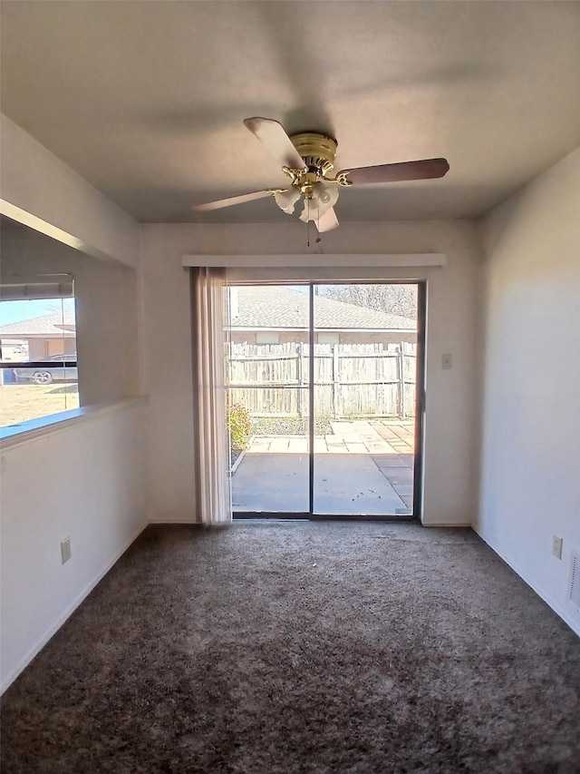 spare room with ceiling fan, carpet floors, and plenty of natural light