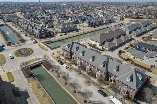 bird's eye view featuring a water view and a residential view