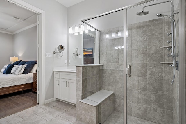 bathroom featuring a stall shower, visible vents, ensuite bathroom, crown molding, and vanity