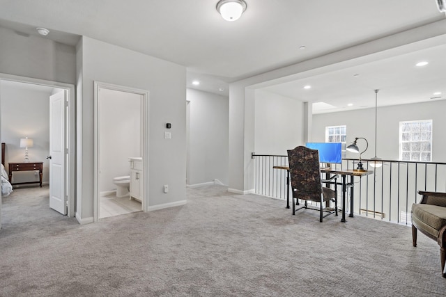 interior space with light carpet, baseboards, and recessed lighting