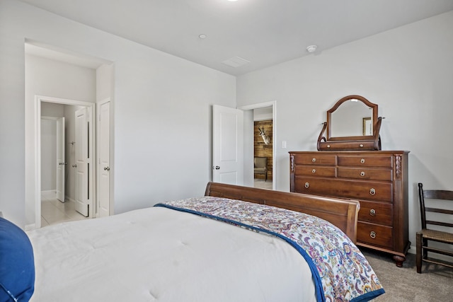 bedroom with light colored carpet