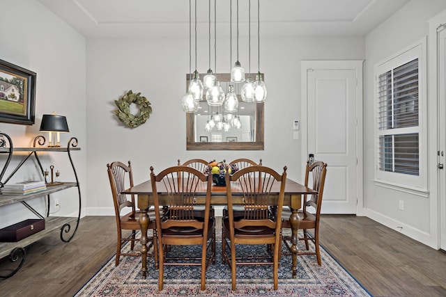 dining area featuring dark wood-style floors and baseboards