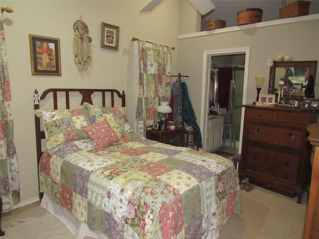 carpeted bedroom with ceiling fan and connected bathroom