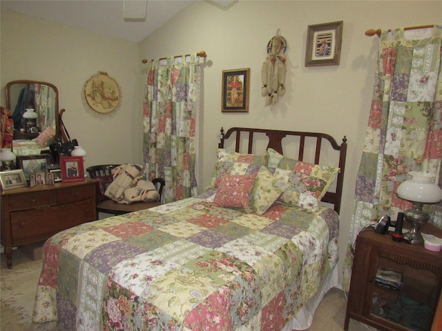 bedroom featuring vaulted ceiling