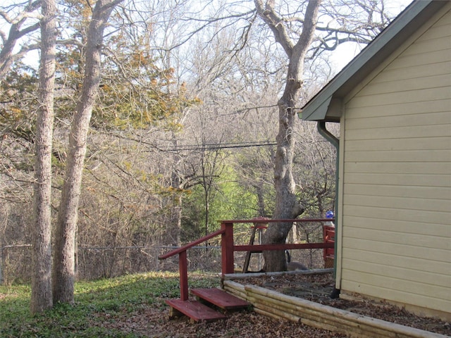 view of yard featuring a forest view