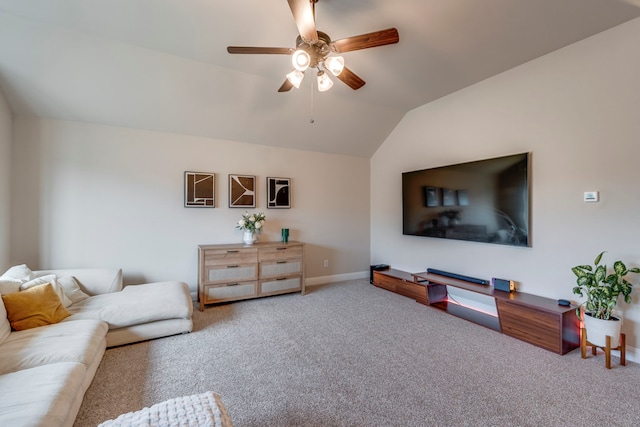 carpeted living room featuring vaulted ceiling, a ceiling fan, and baseboards