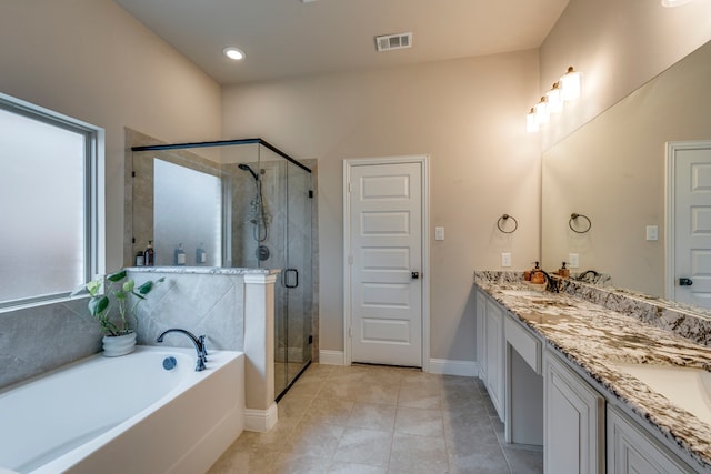 bathroom featuring tile patterned flooring, a sink, visible vents, double vanity, and a stall shower