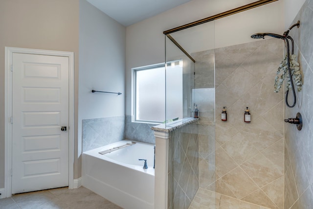 full bath with a stall shower, tile patterned flooring, and a bath