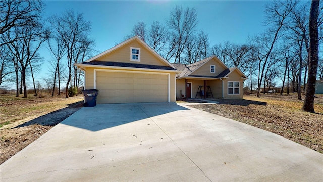 view of front facade with an attached garage and concrete driveway