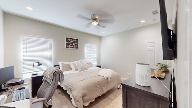 bedroom with ceiling fan, light wood finished floors, visible vents, and recessed lighting