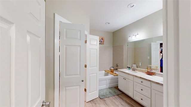 full bath with vanity and wood finished floors