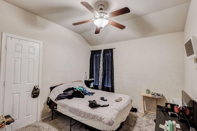 bedroom featuring lofted ceiling, ceiling fan, and light carpet