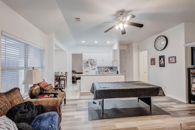 playroom featuring ceiling fan, light wood-style flooring, pool table, visible vents, and vaulted ceiling