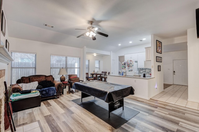 rec room featuring pool table, visible vents, vaulted ceiling, and light wood finished floors