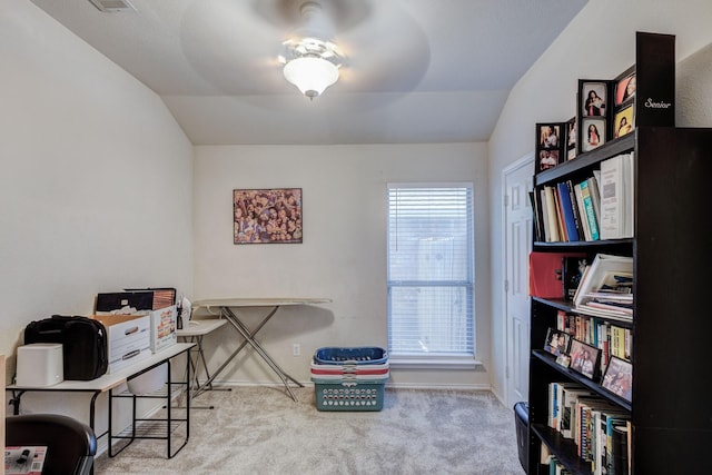 office featuring lofted ceiling and light colored carpet