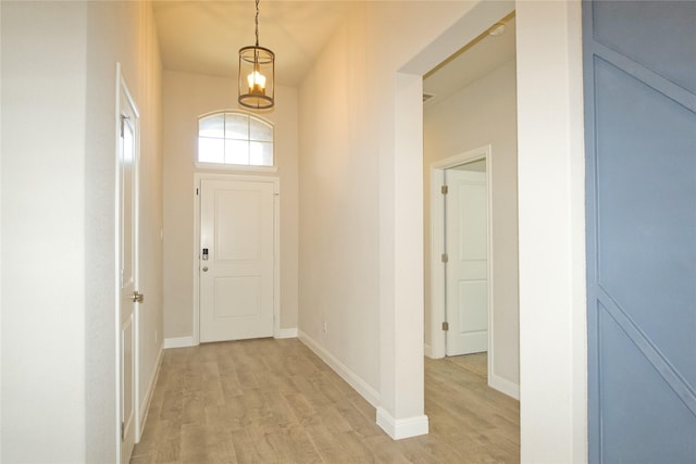 entrance foyer featuring baseboards and light wood-style floors