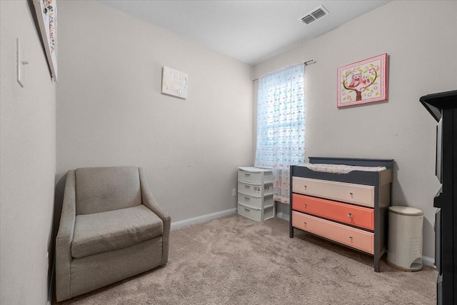 living area featuring light carpet, visible vents, and baseboards