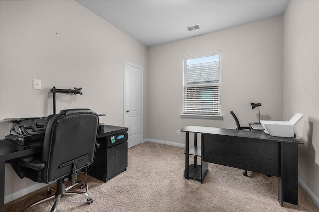 office space with carpet floors, visible vents, and baseboards