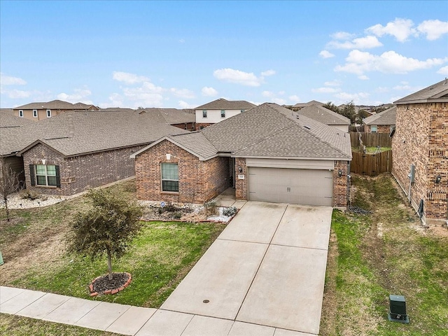 view of front of home featuring brick siding, a shingled roof, fence, and a residential view