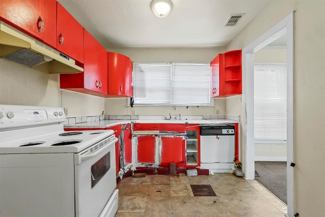 kitchen with under cabinet range hood, electric range, visible vents, dishwasher, and open shelves