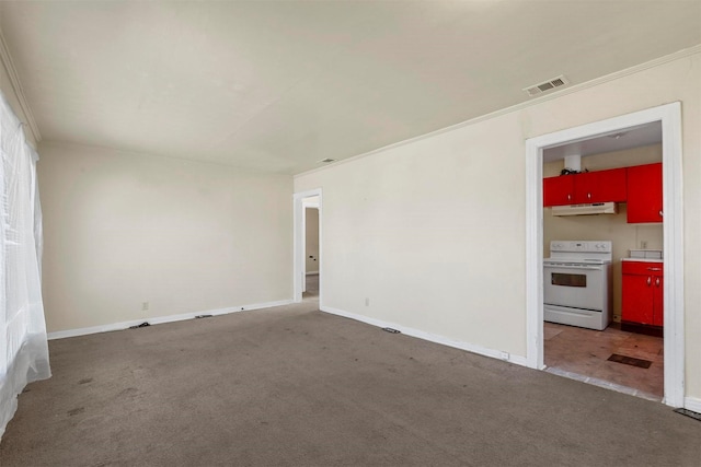 carpeted spare room featuring crown molding, visible vents, and baseboards