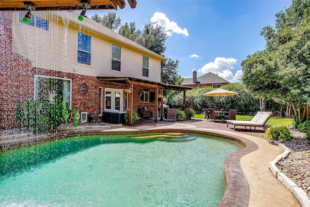 outdoor pool featuring a patio