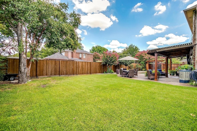 view of yard featuring a patio area, a fenced backyard, and a pergola