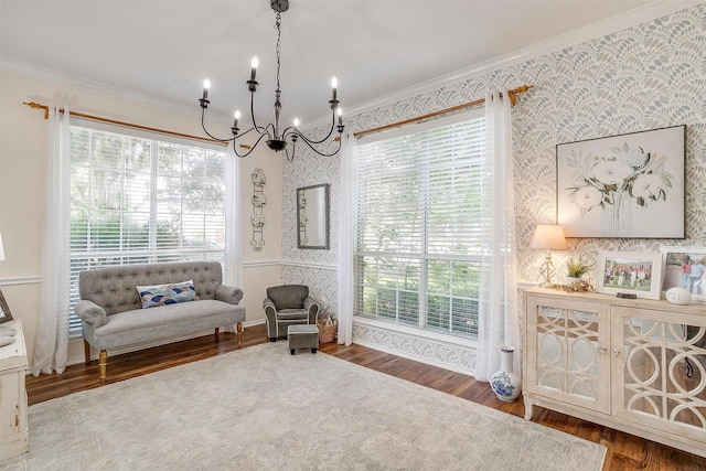 living area featuring wallpapered walls, plenty of natural light, and crown molding