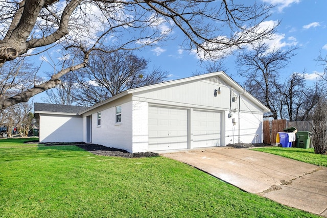 view of home's exterior featuring brick siding, fence, concrete driveway, and a yard