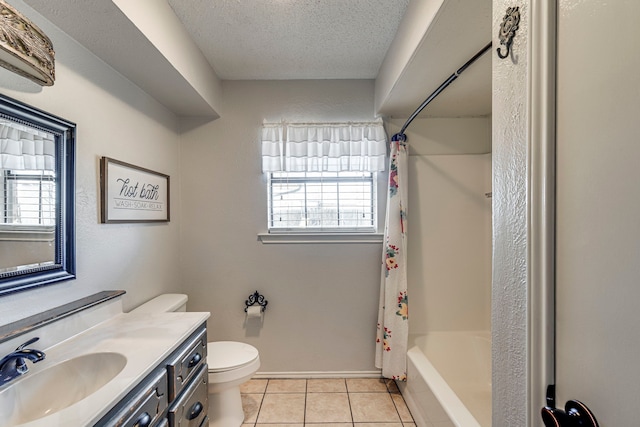 full bath featuring a textured ceiling, tile patterned flooring, toilet, vanity, and plenty of natural light