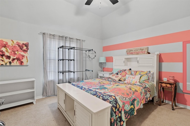 bedroom featuring light carpet, ceiling fan, lofted ceiling, and baseboards