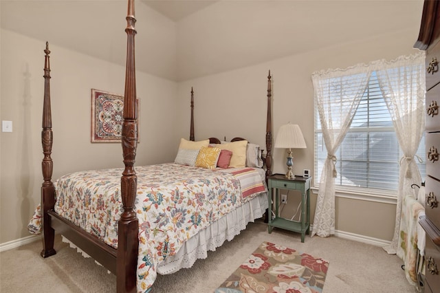 carpeted bedroom featuring baseboards