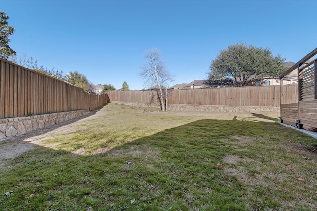 view of yard featuring a fenced backyard