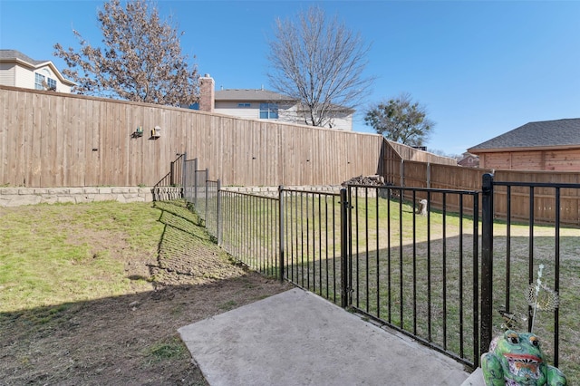 view of yard with a fenced backyard