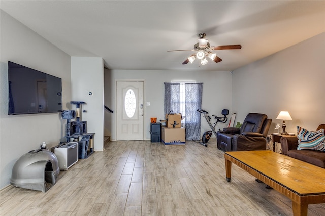 living area featuring ceiling fan and light wood-style flooring